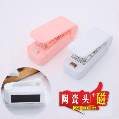 China 2022 Food Sealed Packaging Plastic Bag Sealed Food Bag Mini Handheld Holder Electric Heating Snack Sealing Machine for sale