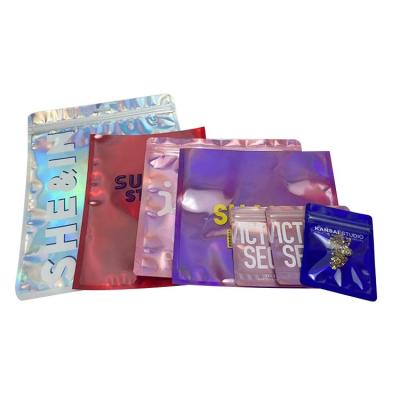 China Recyclable Pink Holographic Seal Fashion Boutique Customized Laser Plastic Ziplock Bags Luxury Packaging Clothing for sale