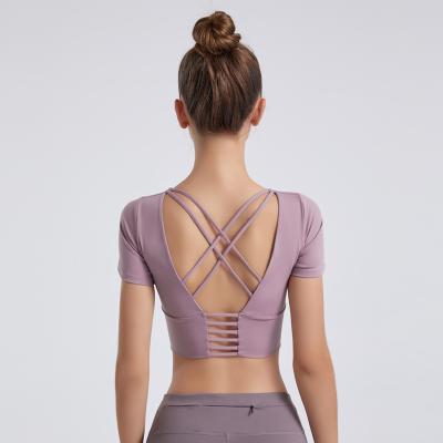 China Breathable Seamless Yoga Top Cross Back Gym Clothes Woman Yoga Top Backless T-Shirt for sale