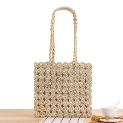 China 2021 Joker Style Macrame Paper Straw Handmade Summer Bag With Pearl Decoration Women Beach Straw Handbags for sale