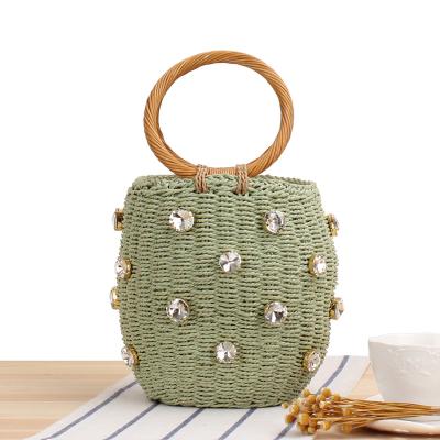 China Joker Style Round Rattan Straw Bucket Bags Bohemian Straw Bags Summer Beach Diamonds Woven Decoration Tote Handbag for sale