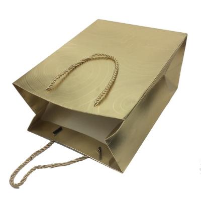 China New Design Disposable Embossed Gift Packaging Cardboard Gold UV Coated Paper Bags for sale