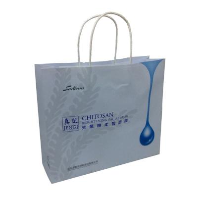 China Wholesale Customized BIODEGRADABLE White Color Print Kraft Paper Bag With Paper Handles In Bue Foil for sale