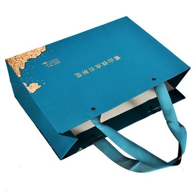 China Recyclable Wholesale Custom Printed Logo Luxury Blue Paper Bag Retail Boutique Shopping Gift Paper Bags With Your Own Logo for sale