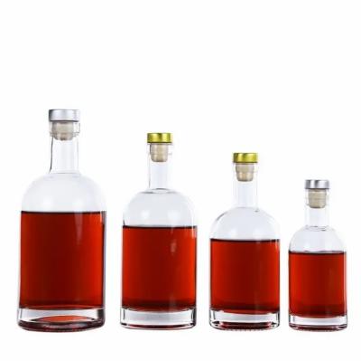 China Beverage 200ml 375ml 500ml 750ml round shape vodka glass bottle with cork lids for sale