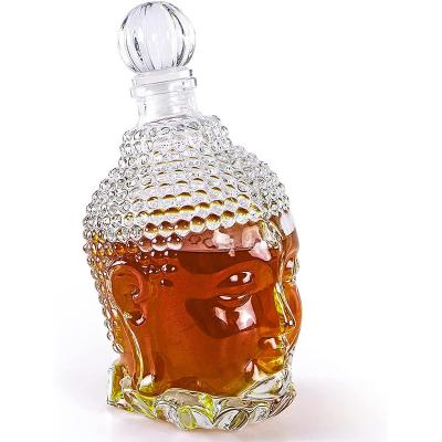 China Hot Selling Hand Made750ml Beverage Head Of A Buddha Shape Cut Glass Decanter Vase For Hotel for sale