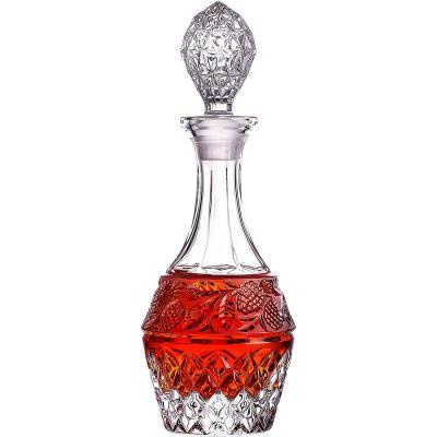 China Beverage New Product 650ml Clear Glass Whiskey Bottle With Lid Drinking Glass Bottle for sale