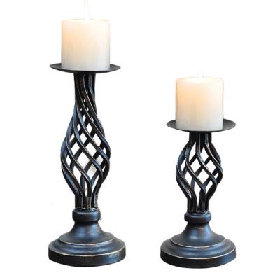 China New classic/postmodern hot sales iron candlestick hollow metal stable decorative candle holder for sale