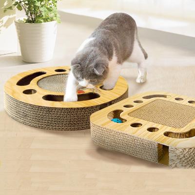 China New Arrival Viable Turntable Bell Ball Wrinkled Multi Holes Cat Grind Claw Training Cat Scratcher Board Paper Toy for sale