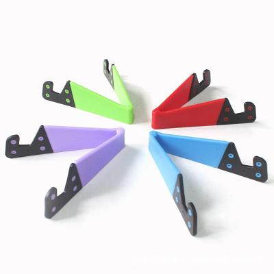 China Universal Modern Portable Foldable Adjustable V Shape Phone Lazy Stand For Tablet For All Mobile Phones for sale