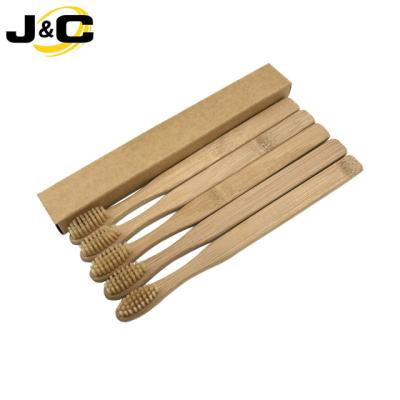 China Disposable Organic Natural Bamboo Toothbrush With Charcoal Infused Soft Bristles for sale