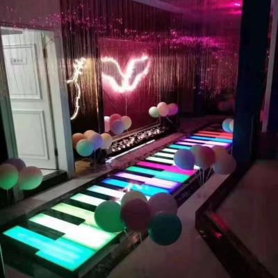 China Commercial Theme Park Furniture Glamorous Giant Led Piano Floor Dance Step Play Music Floor Light Up Piano Finish Laminate Flooring for sale