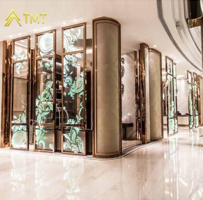 China PVD Plating Decorative TMT Metal Screen and Club Glass Design Lobby Hotel Art Divider Project for sale