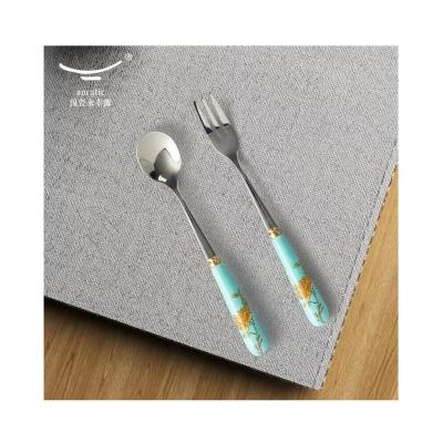 China Viable China Manufacturer 2 Elegant Fancy PSC Handle Stainless Steel Ceramic Dinner Cutlery Set for sale