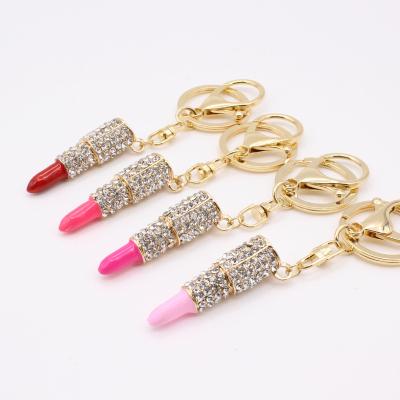 China New Design Lip Gloss Factory Direct Sale Metal Rhinestone Lipstick Lip Gloss Cute Car Key Chain for sale