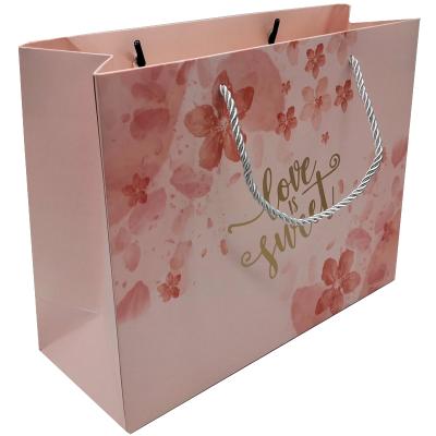 China New Arrival Golden Logo Recyclable Gift Shopping Paper Bag Small Pink Paper Bag Package With Rope Handle for sale