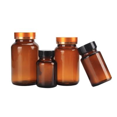 China 60ml 100ml 150ml 500ml Pharmaceutical Amber Glass Capsule Packaging Medicine Tablets Pill Vitamin Bottles With Lid for sale