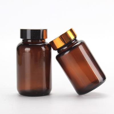 China Medicine Customized Pill Bottle Health Food Vitamin Amber Empty Glass Bottle 100ml 200ml 300ml 500ml Medicine Container With Screw Cap for sale