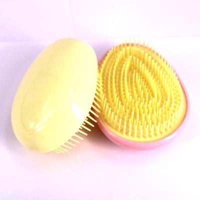 China Compact Kids Brush Hair Egg Kids Hair Brush Custom Logo Plastic Detangling Hair Brush for sale