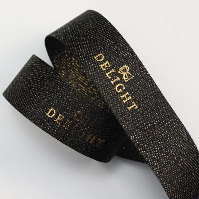 China Custom high tenacity polyester single face printing logo black glitter herringbone ribbon for high grade gift box packaging for sale