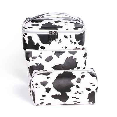 China New High Quality Cow Pattern PVC Cosmetic Bags Waterproof Women Shape Black And White Cute Cow Printed For Traveling Cosmetic Bags for sale