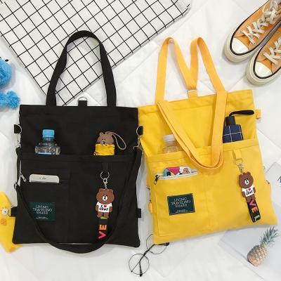 China Newspaper Used 2021 Fashion Canvas Student Tote Bag Large Capacity Female Book Handbag Cartoon Cross - Body Bag for sale