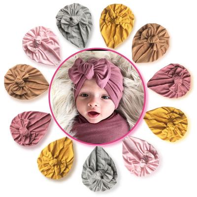 China Soft Cute Bows Baby Hat Solid Color Infant Toddler Kids Beanie Turban Newborn Hat for sale