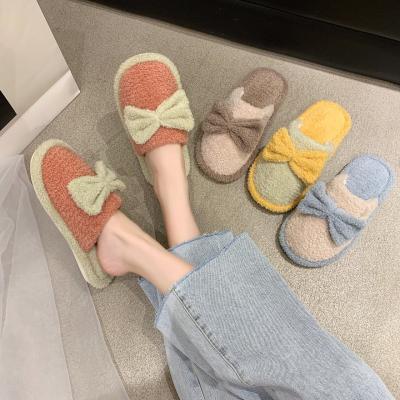 China Indoor Slippers TPR Bottom Fashion Trend Bowknot Bedroom Warm Winter Slip On Cotton Terry Slipper for sale