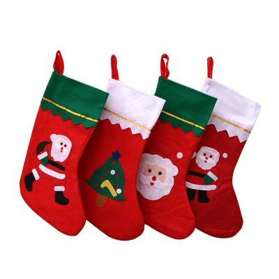 China 2021 Hot Selling Christmas Sewing Fabric Christmas Socks Polyester Fabric Christmas Stockings Fabrics Accessories Snowman Print for sale