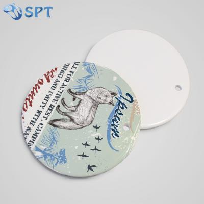 China Custom Printing Sublimation Two Sides Round Shape White Ceramic Blank Blank Ornament For Christmas for sale