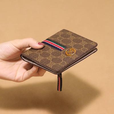 China RFID New European and American Wine God Small Wallet Women's Short Genuine Leather Versatile Handbag Folding Cowhide Women's Money Ba for sale