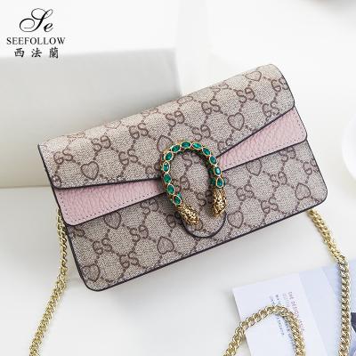 China Fashion Wine God Fashion Chain Bag Women's Genuine Leather One Shoulder Crossbody Bag Simple and Versatile Snake Head for sale