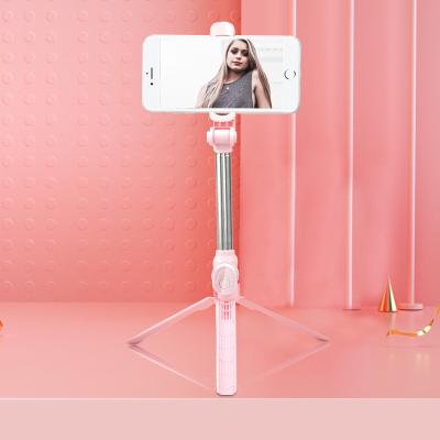 China Low MOQ XT10 Foldable Mini Selfie Stick Plastic Wireless BT Selfie Stick Tripod Foldable Remote Control Telescopic Holder for sale