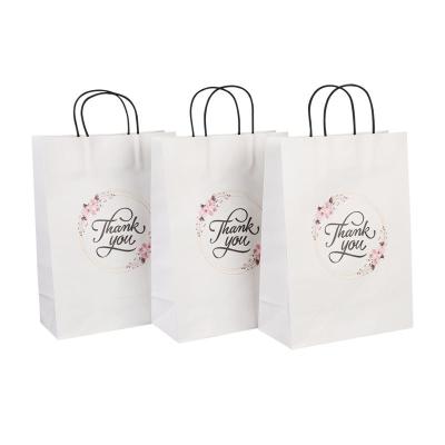 China WEIHAI YouDe New Arrival Handmade Paper Bag Packaging With Our Own Logo Paper Suitcase Printed Customized Paper Bag For Envelope for sale