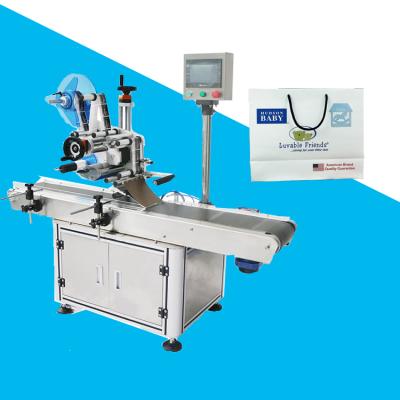 China automatic food pouch labeling machine plastic bag self adhesive labeling machine for sale