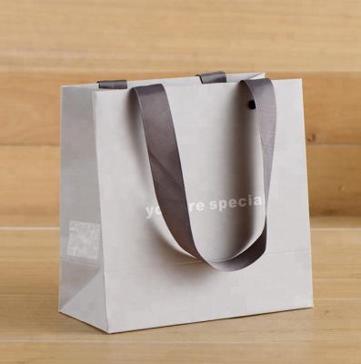 China Recyclable Luxury Printed Paper Shopping Bag With Ribbon Handle For Gift Packaging for sale