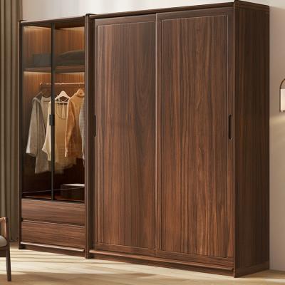 China Contemporary Nordic Simple Solid Wood Modern Simple Sliding Door Wardrobe Black Walnut Household Bedroom Sliding Door Storage Locker for sale