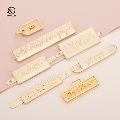 China Eco-Friendly Design Engraved Brand Logo Metal Custom Metal Plate Logo Metal Logo Fashion Tag for sale