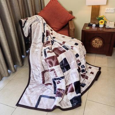 China 2022 Wearable Popular Fashion Innovative Weaving Process Embossed Soft Geometric Raschel Polyester Blanket for sale