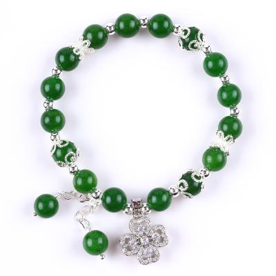 China 8MM Jade verde escuro com spinner flor encantamento cura espiritual forma redonda bracelete de conta de estiramento à venda