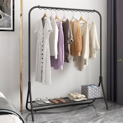 China New multifunctional simple door body creative floor pole bedroom style clothing racks living room fashion rack for sale