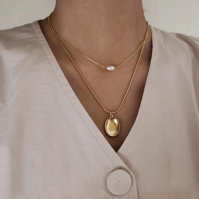 China Newest Lead Free Nickel Free Minimalist Gold Plated Coin Hollow Out Pendant Necklaces Double Layered Natural Freshwater Pearl Necklaces for sale