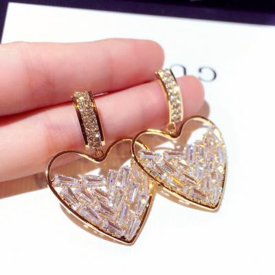 China Exquisite Crystal Sparkling Heart Shape Stud Earrings Inlay New Cavity Designs Geometric Heart Drop Earrings Lead Free Nickel Free for sale