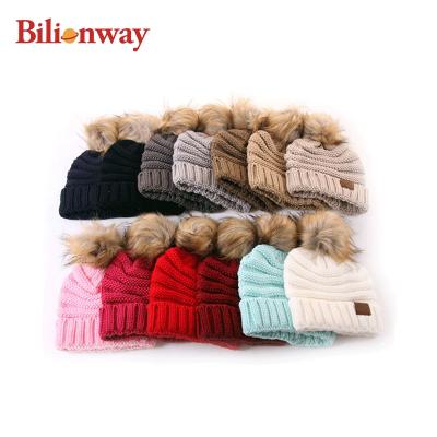 China Wholesale Custom Pom Pom Baby Toddler Children Winter Plush Private Label Double Knitted Beanie Hats with Fur Pompom for sale