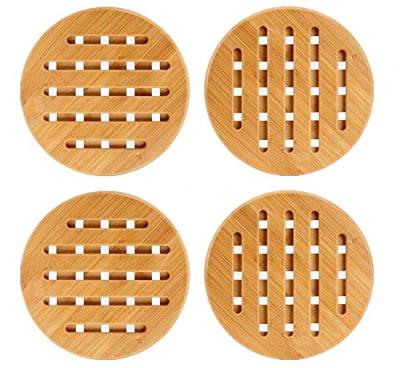 China Viable set of 4 solid bamboo wooden tripods with non-slip pads for hot dishes for sale