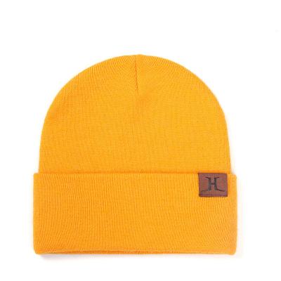 China JOINT Winter Women Acrylic Custom Hats Knitted Woman's Winter Hats Woven Label Beanie for sale