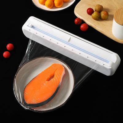 China Food Kitchen Tool Plastic Hand Held Magnetic Cling Wrap Box Dispenser for sale