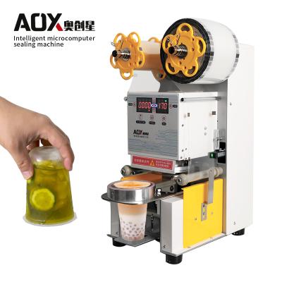 China Food Intelligent Microcomputer High Speed ​​Bubble Tea Cup Sealing Machine for sale