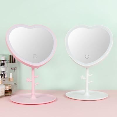 China Customization Personalized Heart Shape Portable LED Desktop Mirror Small 3 Color Lighting HD Touch Screen Makeup Mirror for sale