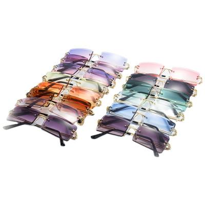 China Fashion sunglasses sets 2021 newest arrival designer 2022 newest fashion cheap rimless lady sunglasses gold glass for sale